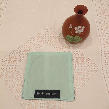 Set of 2 Vietnamese hand-embroidered coasters in a lotus motif, blue and brown