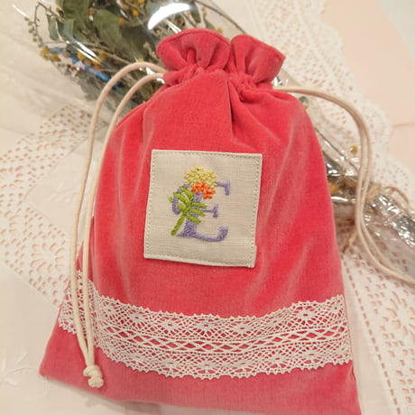 Hand-embroidered initial E drawstring bag