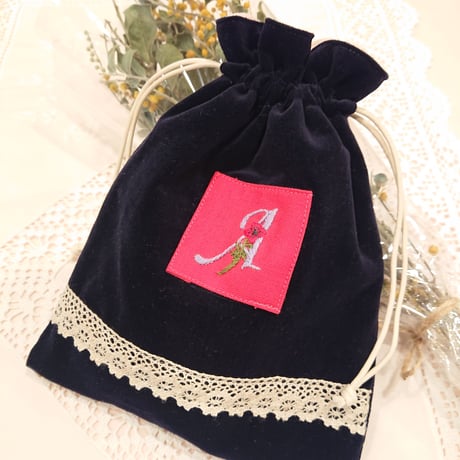 Hand-embroidered initial A drawstring bag